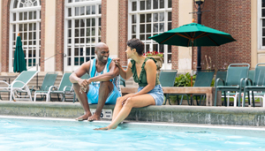 A couple at the pool near Gideon Putnam